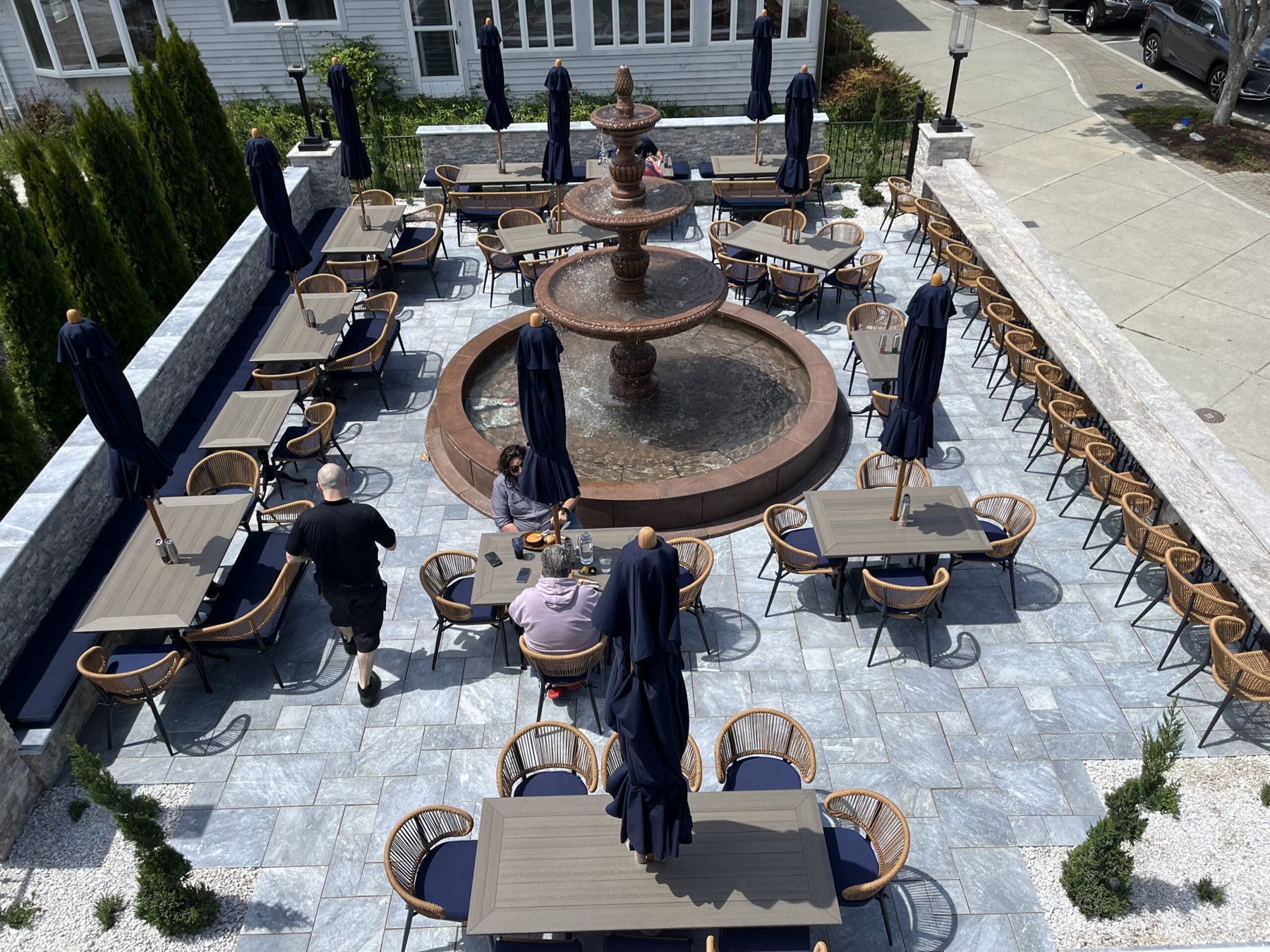 Outdoor dining around the fountain in The Garden at Summer House